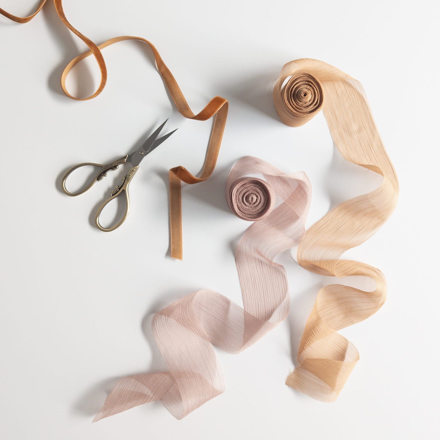 Bridal accessories styled with delicate chiffon ribbon for a romantic aesthetic
