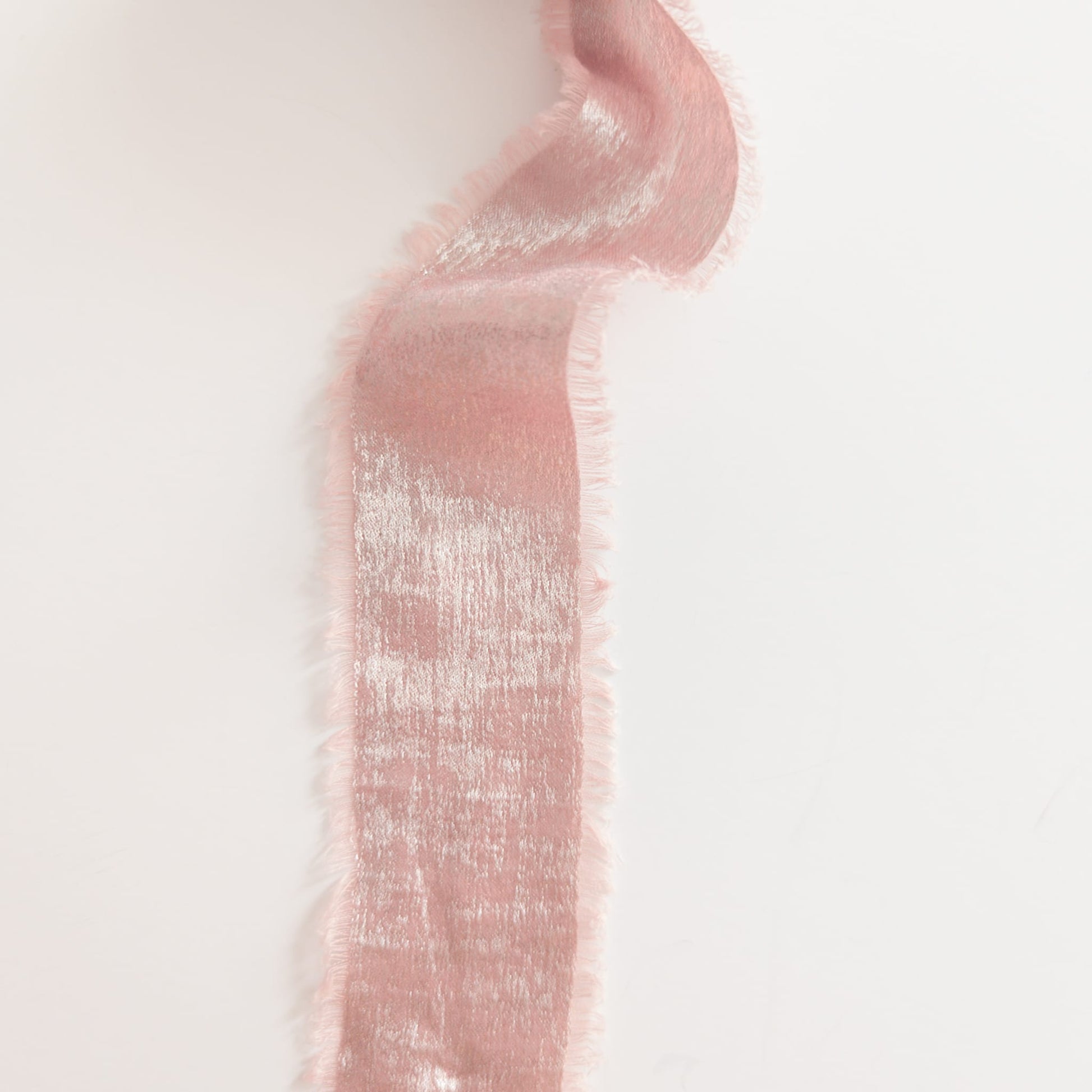 Close-up of ribbon texture showing color-shifting shimmer
