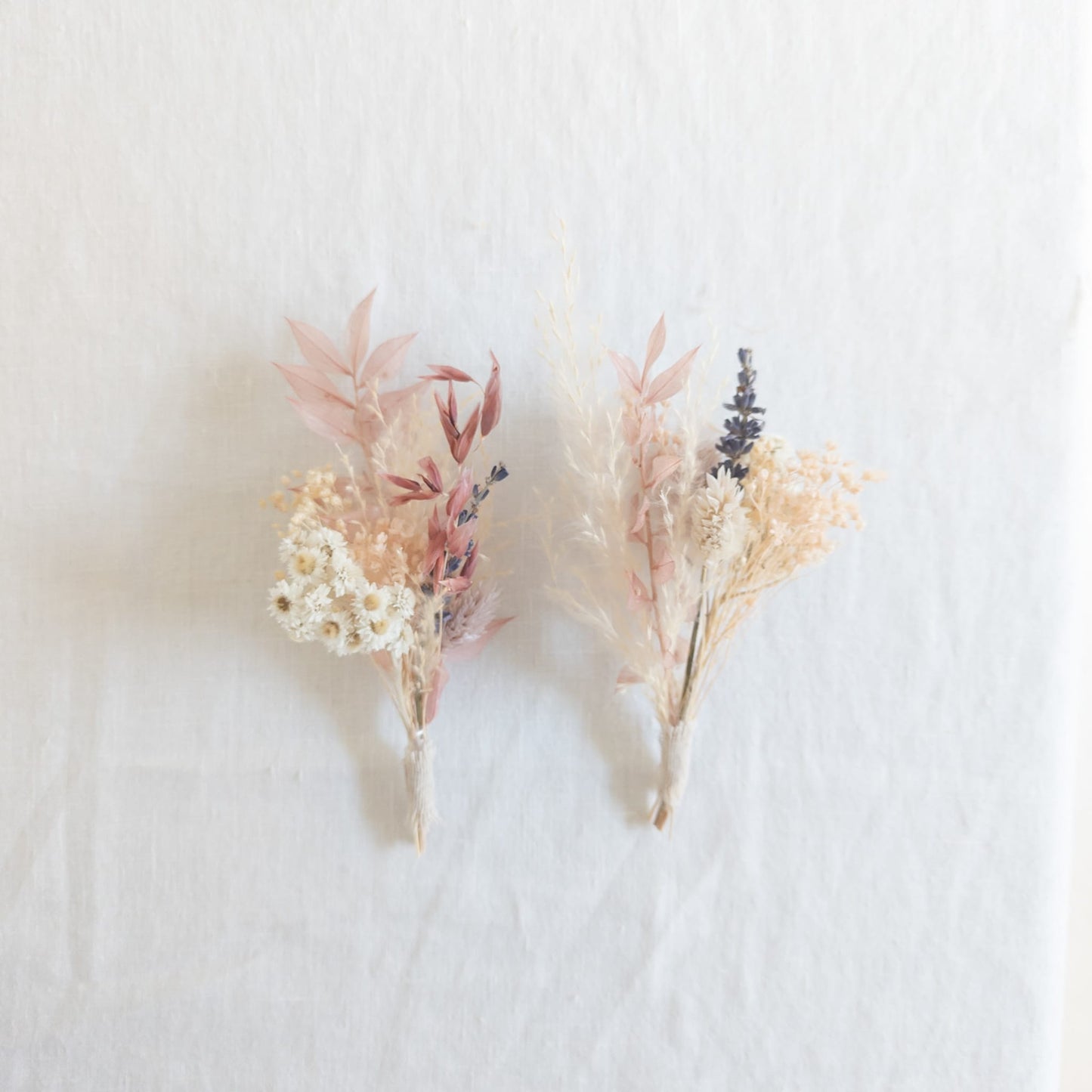 Flat lay of a mini bud vase bouquet with ribbon and packaging