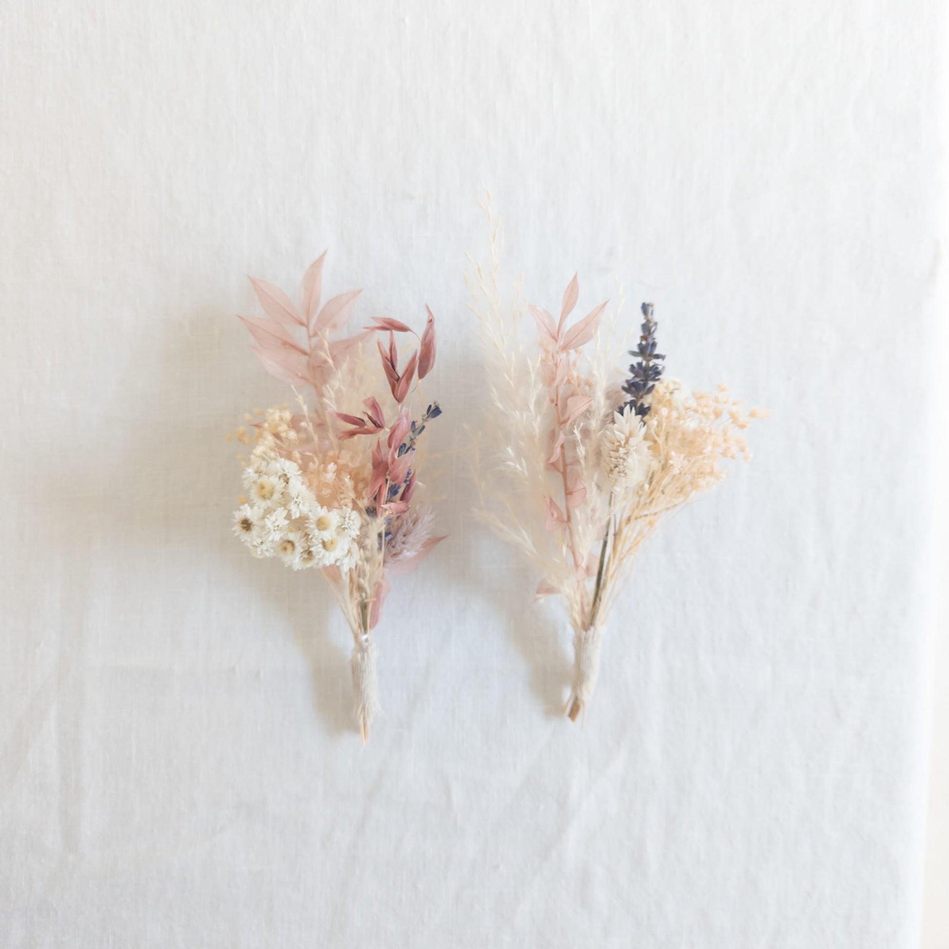 Flat lay of a mini bud vase bouquet with ribbon and packaging